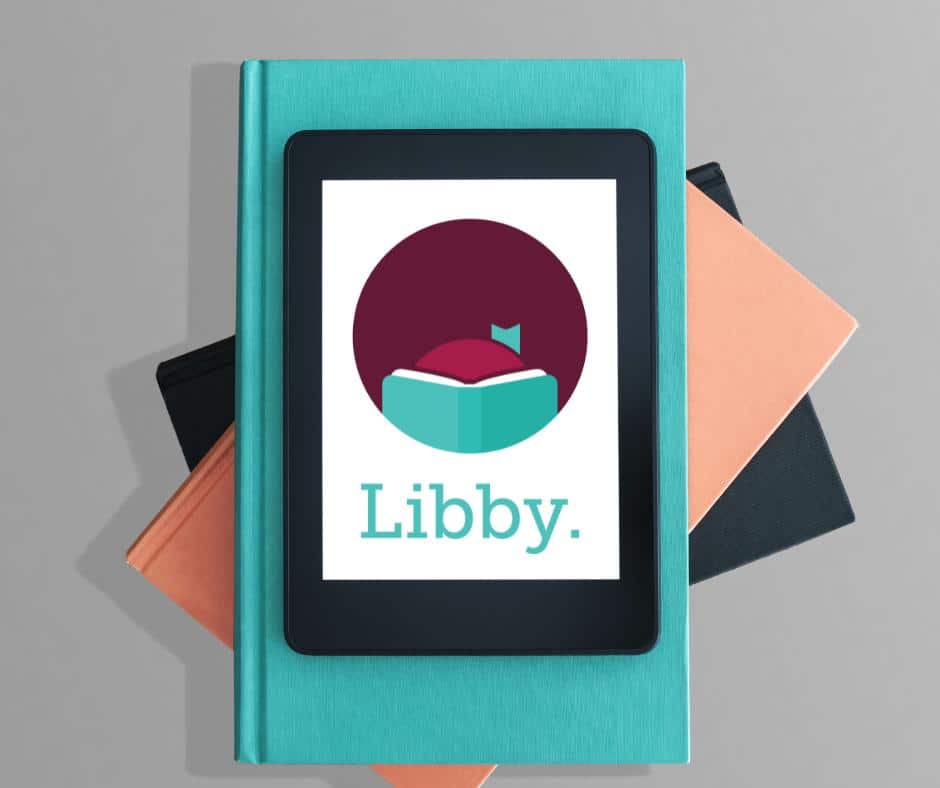 Books with tablet with Libby Logo on it.